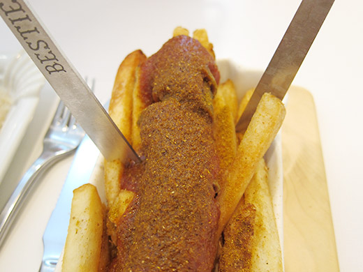 Currywurst ($8): Smoky Bison sausage topped with curried ketchup served over a bed of crispy fries. 