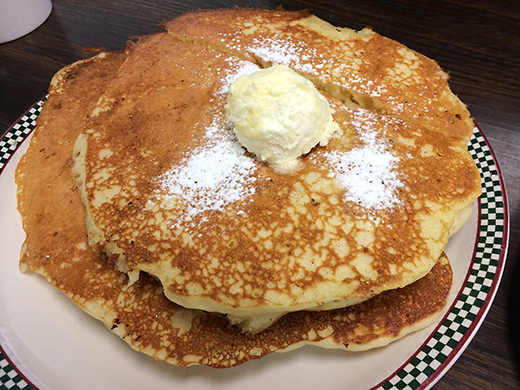 Short stack of Buttermilk Pancakes ($5) -- served with whipped butter and warm maple syrup.