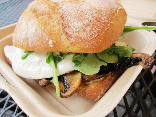 The Arbor Lodge Sandwich ($7.50): A single egg done over medium with grilled organic portobello mushrooms, balsamic caramelized onions & organic baby arugula, dressed with with herbed aioli on a grilled Ciabatta roll.