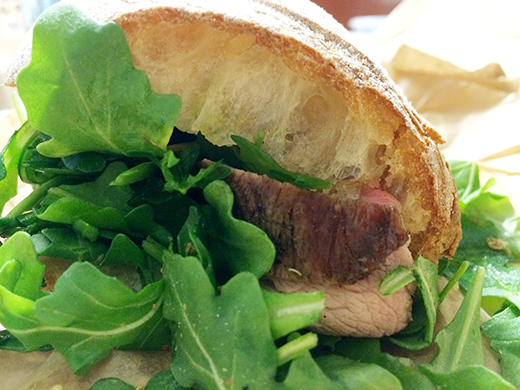 The Porchetta Sandwich ($9) - Grilled pork shoulder, roasted garlic, fennal pollen, arugula and lemon sandwiched between a house-baked bread.